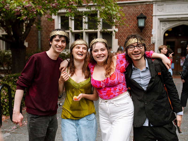 Four Reed seniors celebrating during Thesis Parade.